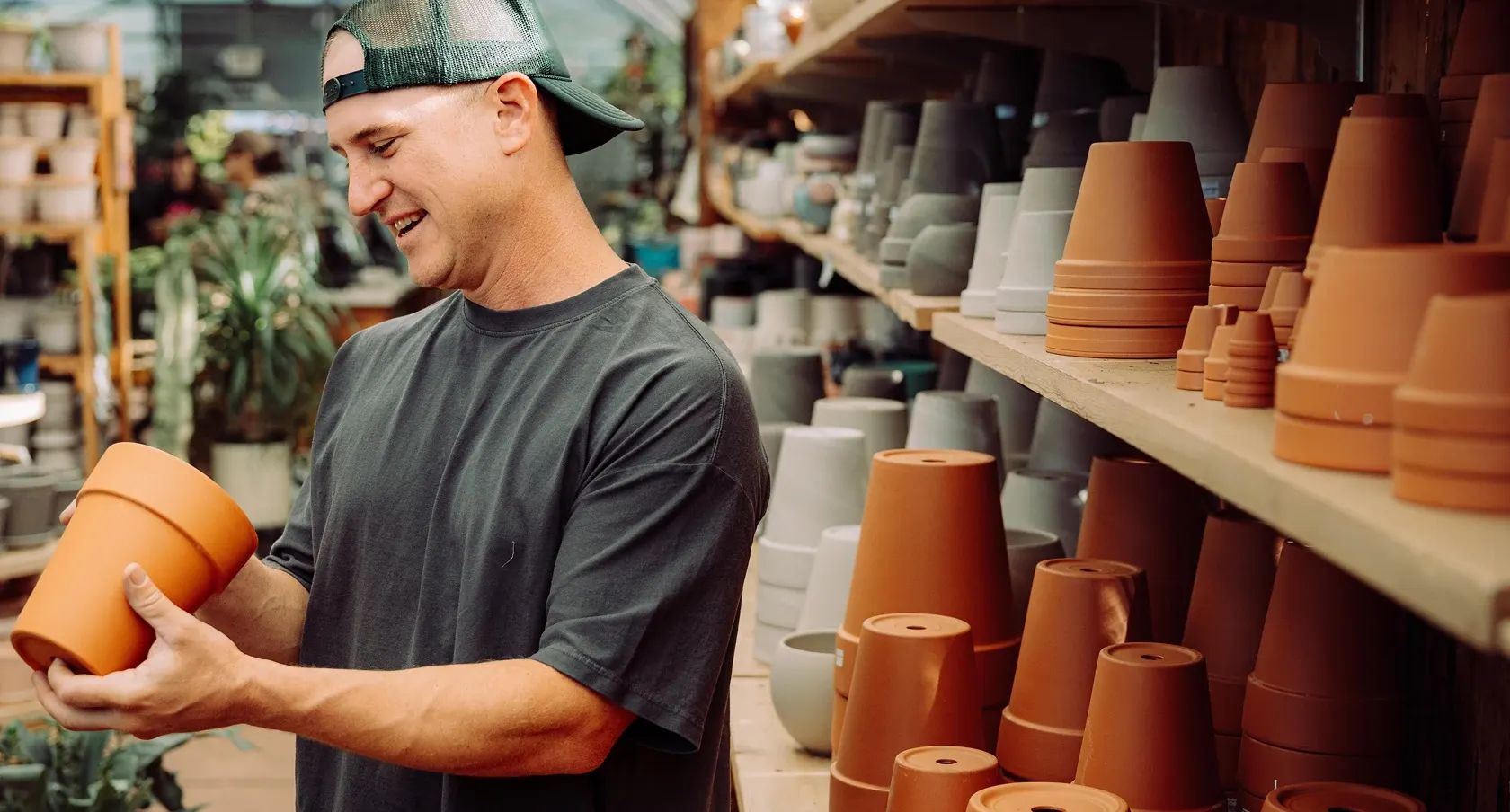 Man holding a clay pot