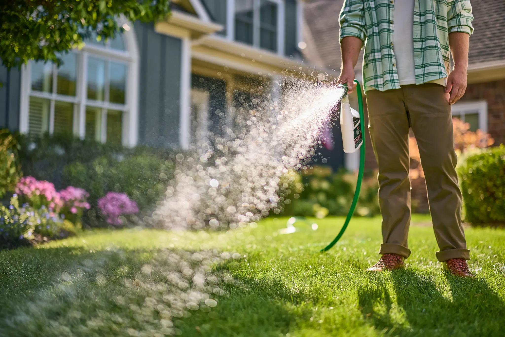 Applying Tick B-gon to lawn