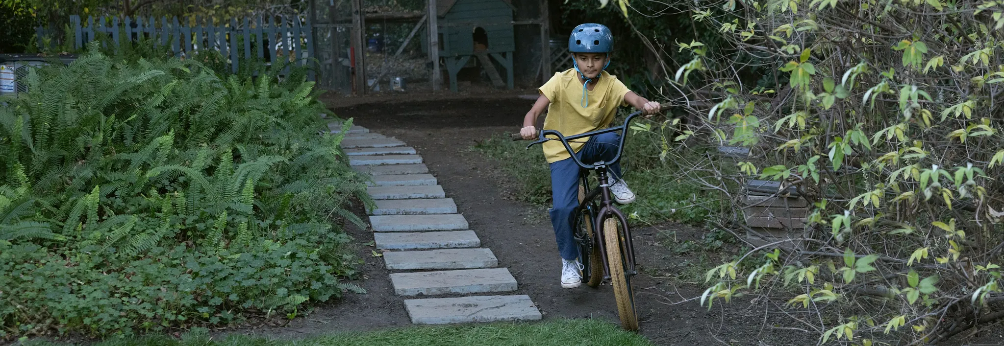 son riding a bike