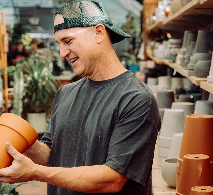 Man holding a clay pot