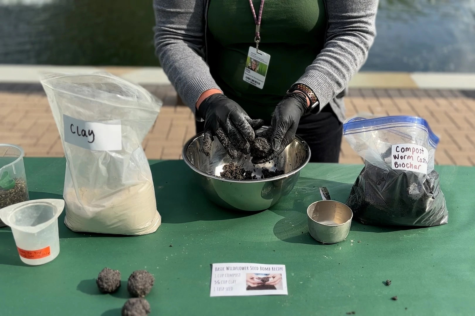 Making seed bomb balls with wildflower seeds, clay and compost