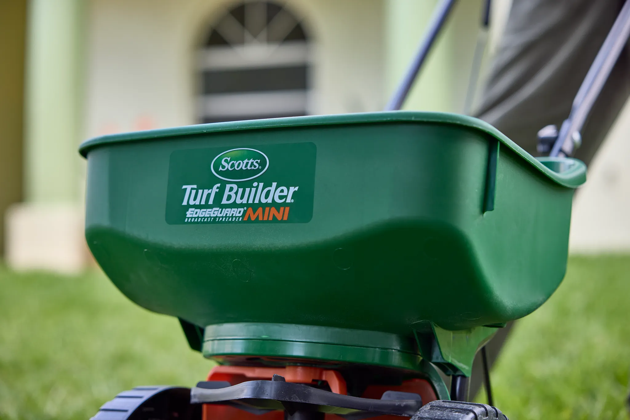 Close-up of Scotts Mini broadcast spreader hopper.