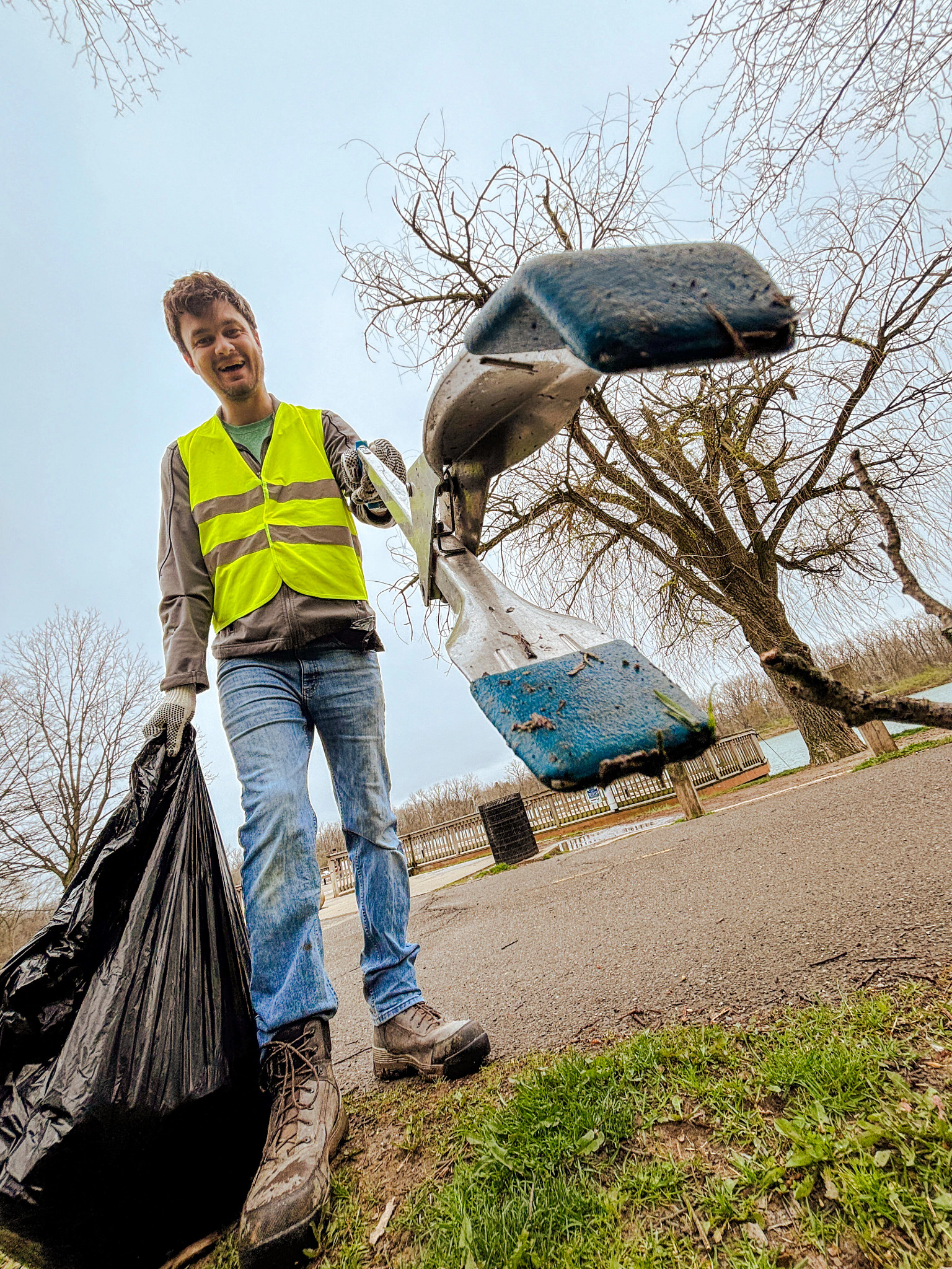 ScottsMiracle-Gro associate picking up litter